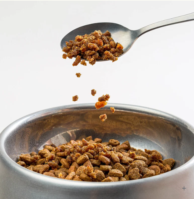 Beef Sprinkles spooned into a dog bowl