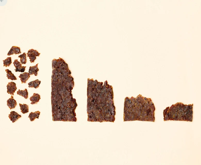 Cheeseburger treat pieces in decreasing sizes