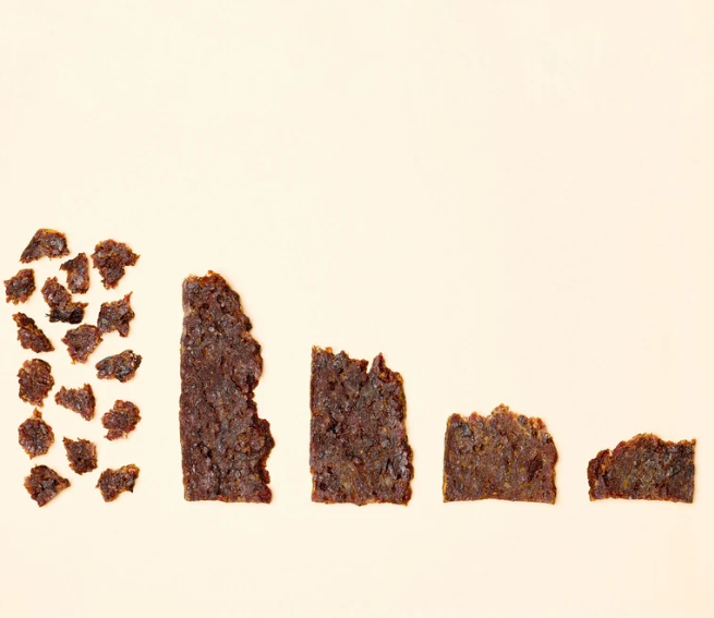 Pork & Apple treat pieces in decreasing sizes